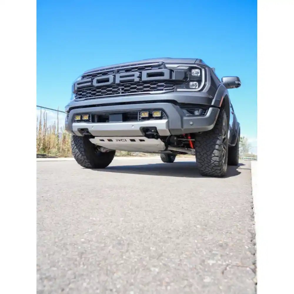Front view of black RCI skid plates on Ranger bumper area.