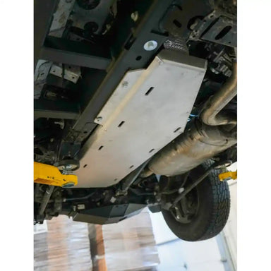 Fuel tank armor mounted near rear axle