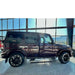 Full side profile of maroon G-Class showing rock slider protection