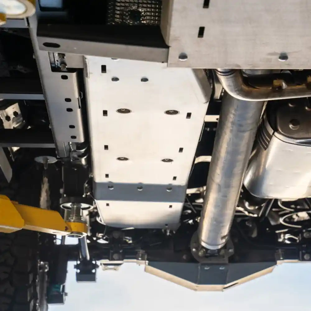 Full underbody view showing installed RCI fuel tank skid plate in silver