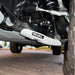 Full undercarriage view: RIVAL skids on both lower control arms
