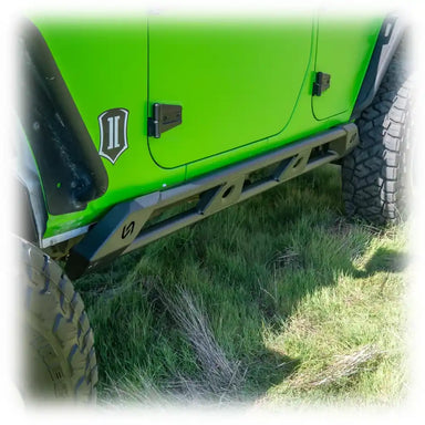 Green Jeep JK with Turn Offroad rock sliders installed