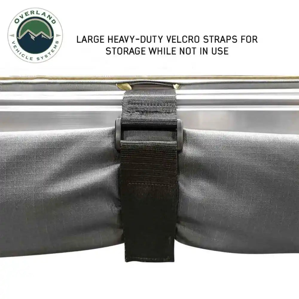 Large heavy-duty velcro strap on a storage roll with Overland Vehicle Systems logo.