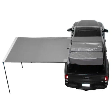Car with a 90 degree gray awning extended over the back on a white background