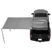 Car with a 90 degree gray awning extended over the back on a white background