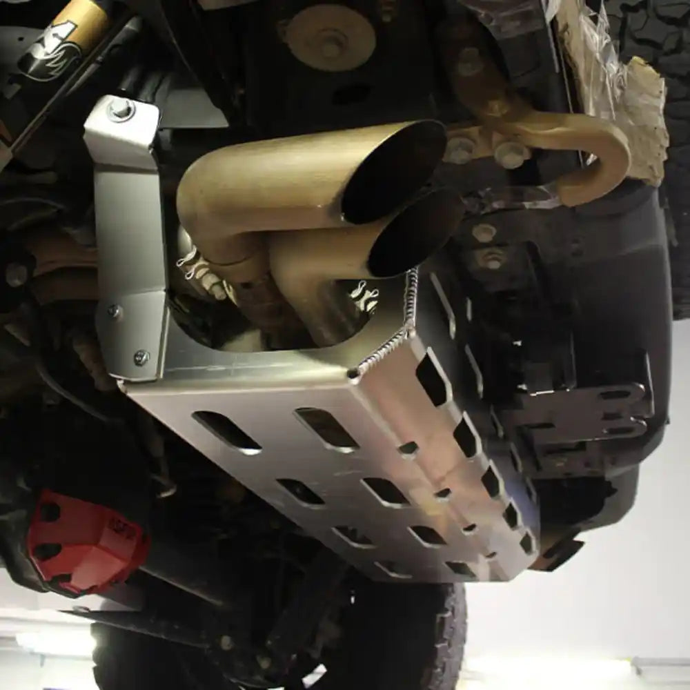 Installed Asfir exhaust skid plate protecting catalytic converters