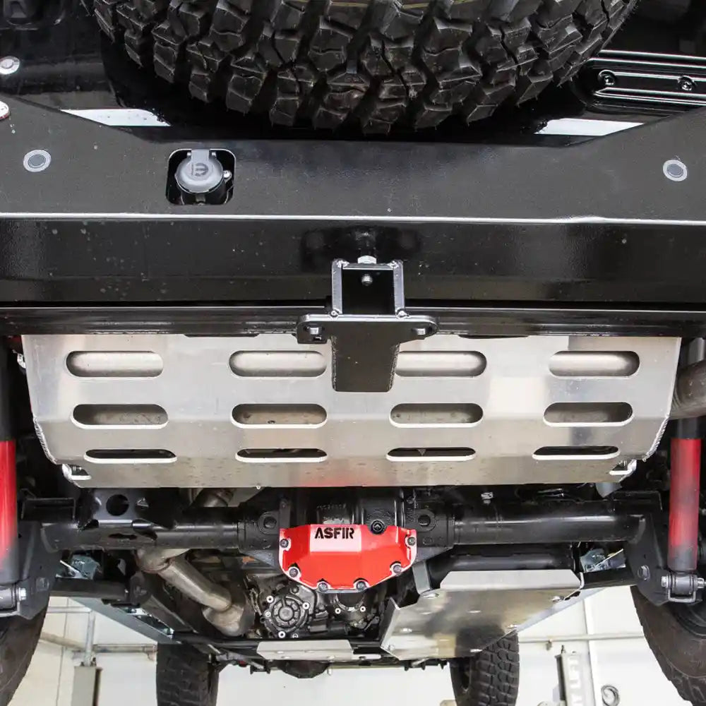 Installed Asfir transfer case and exhaust skid plates on a Jeep Wrangler JL 4XE.