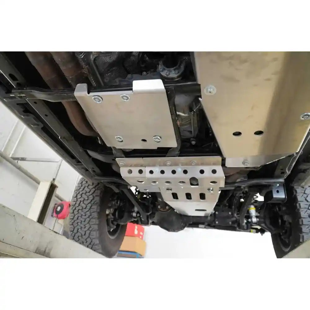 Installed Asfir transfer case skid plate on a Jeep Wrangler JL.