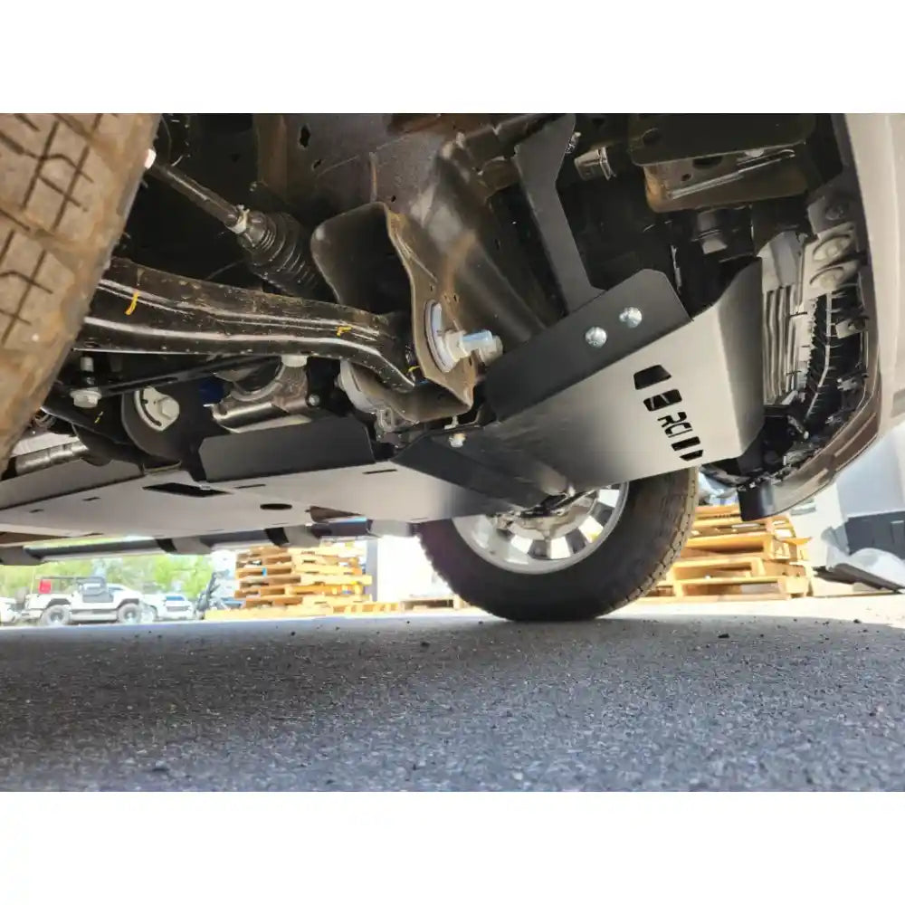 Installed RCI skid plate protecting Silverado undercarriage, side view from wheel