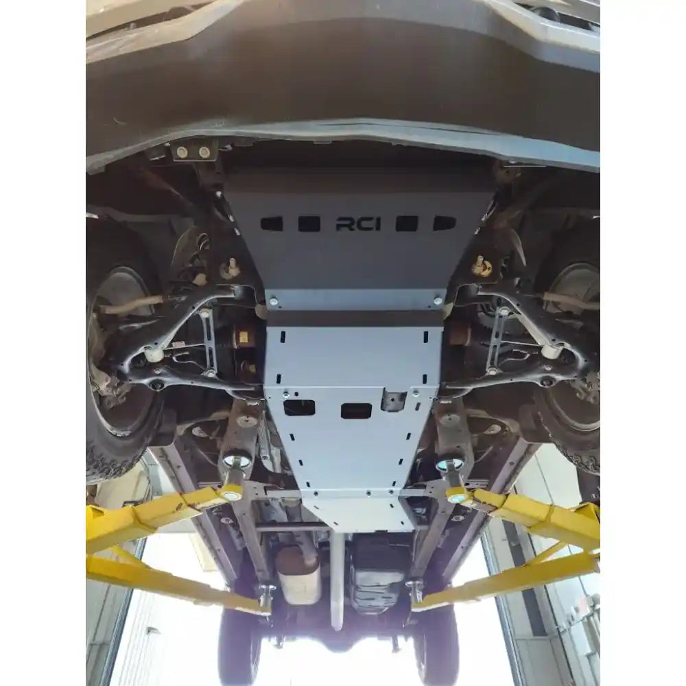 Installed RCI transfer case skid plate on Silverado, full underbody front view