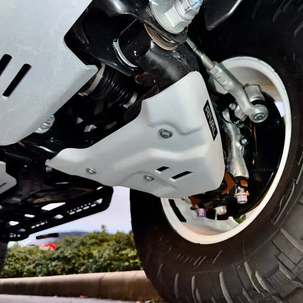 Installed RIVAL lower control skid plate – side angle near suspension