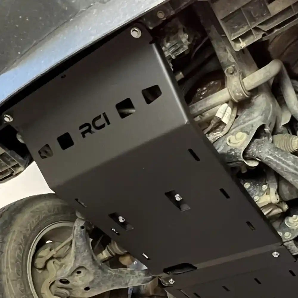 Installed black RCI plate from rear underbody perspective