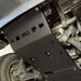 Installed black RCI plate from rear underbody perspective