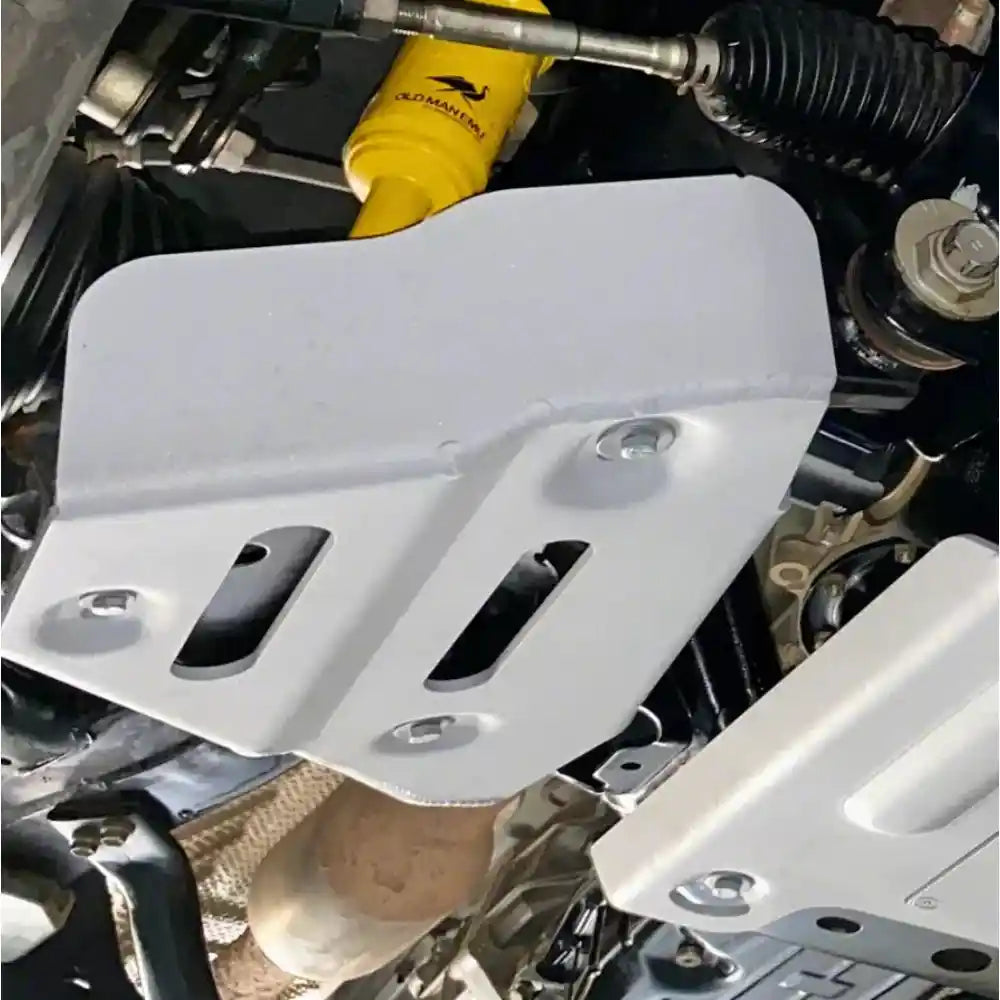 Installed view: RIVAL aluminum skids protecting lower control arms