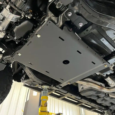 Large aluminum RCI transmission guard fully mounted on vehicle