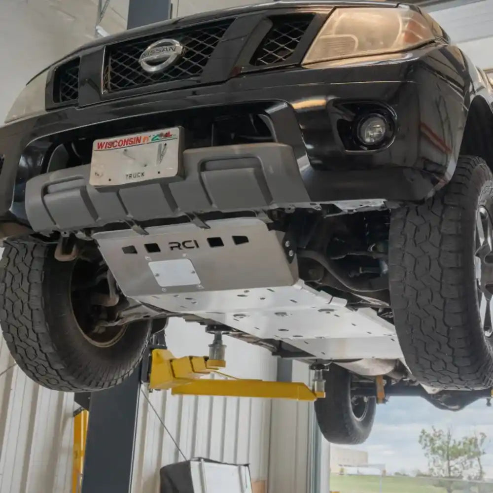 Nissan Frontier rear underbody showing RCI transmission and transfer case skid plates