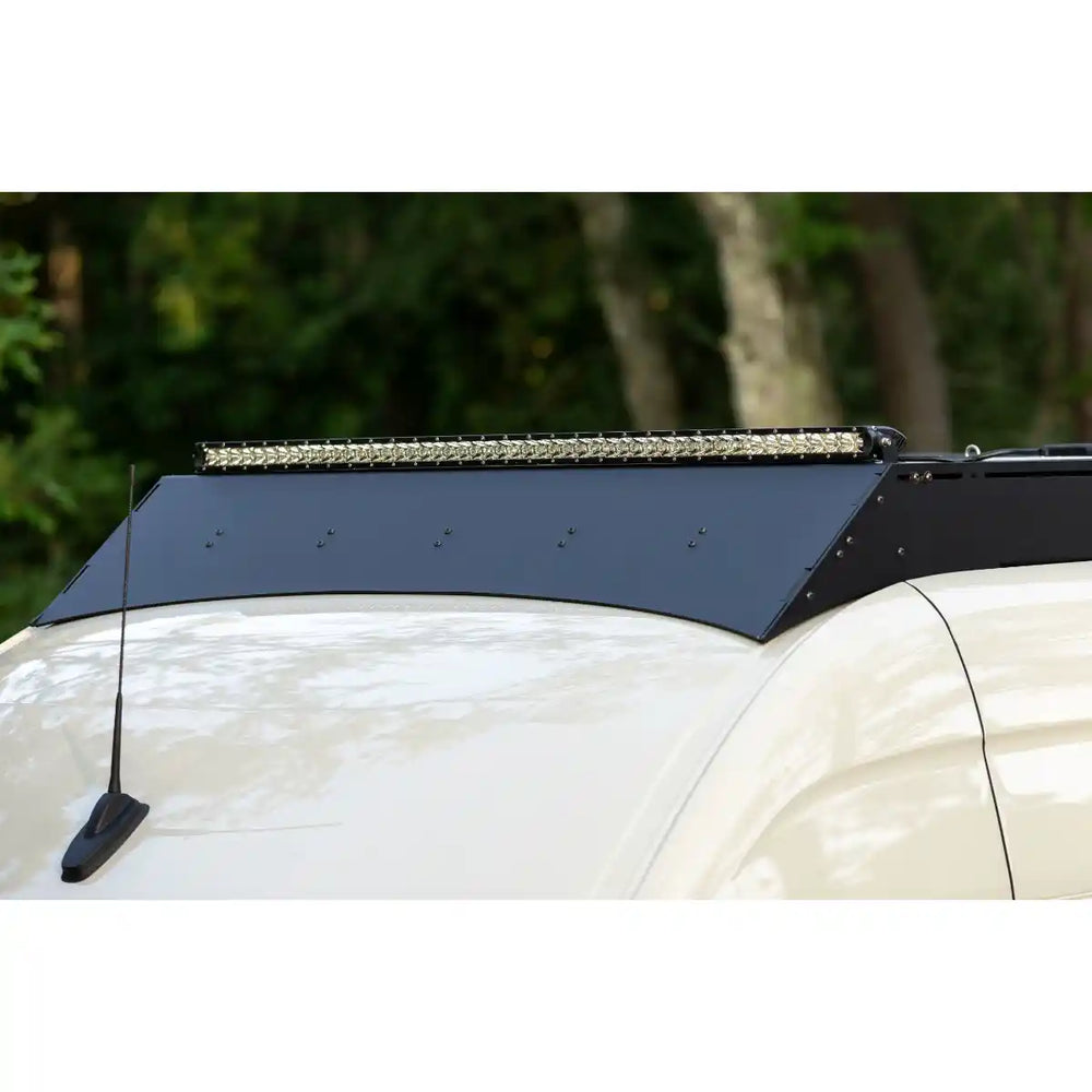 roof rack with LED light bar on a white car against a blurred natural background