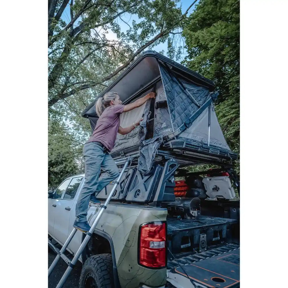  Person setting up RTT on Leitner Designs ACS FORGED bed Rack For Gladiator