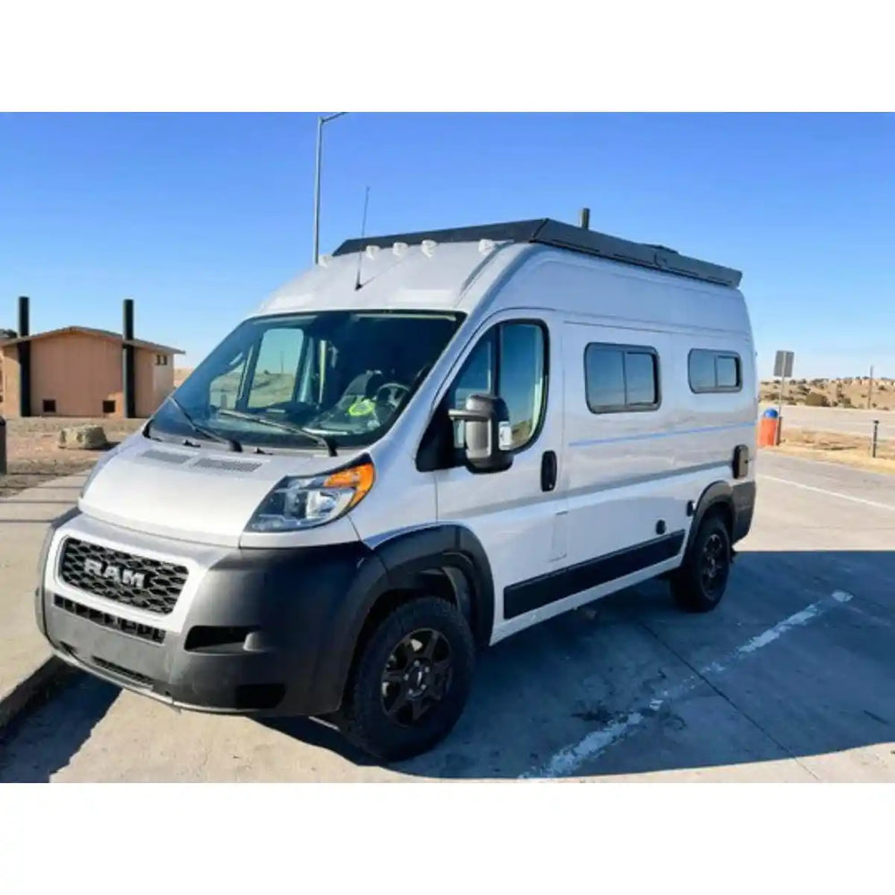 White Solis van with black Orion roof rack on a clear day