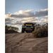 RCI-equipped Ranger off-roading on desert trail under cloudy sky.