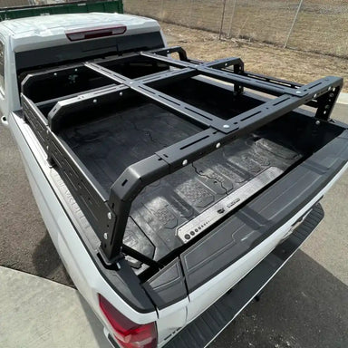 RCI HD bed rack installed on white Tacoma bed