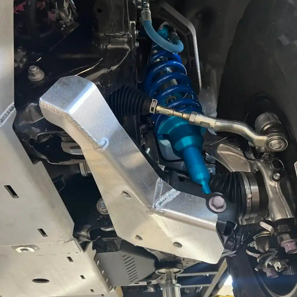 RCI Offroad A-arm skid plates bolted to frame and control arms