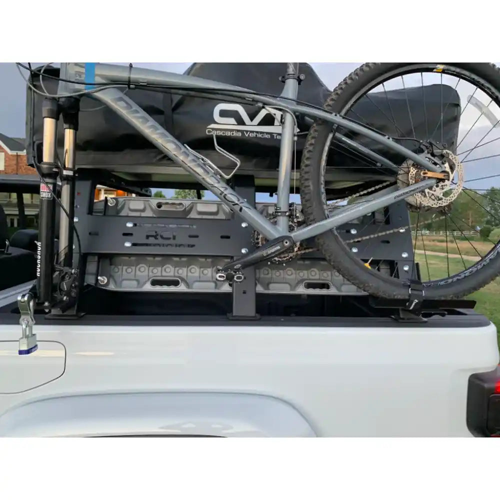 RCI Offroad bed rack with bike and rooftop tent in truck bed