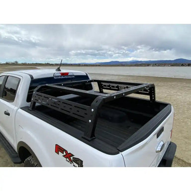 RCI black bed rack on white F-150 truck bed, rear view