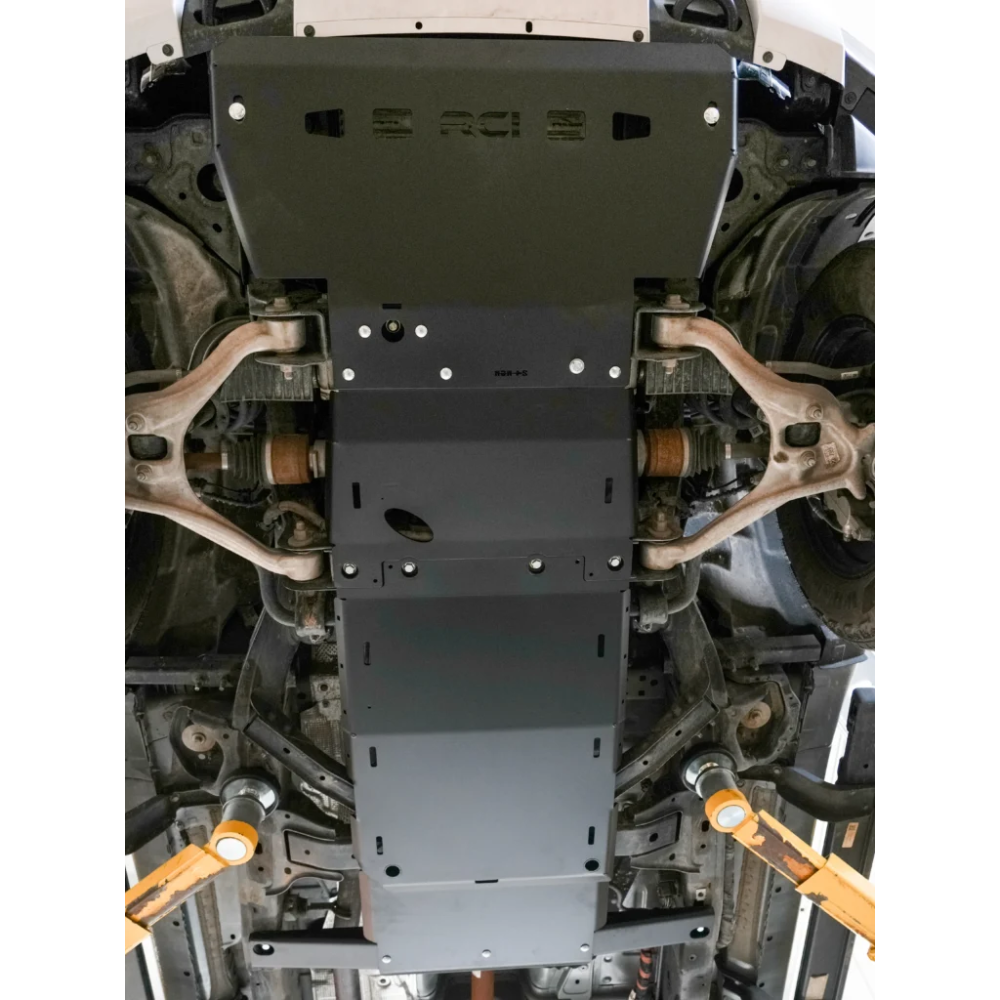 RCI engine skid plate bolted on lifted Ranger underside.
