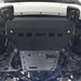 RCI front skid plate bolted under Ranger in workshop.