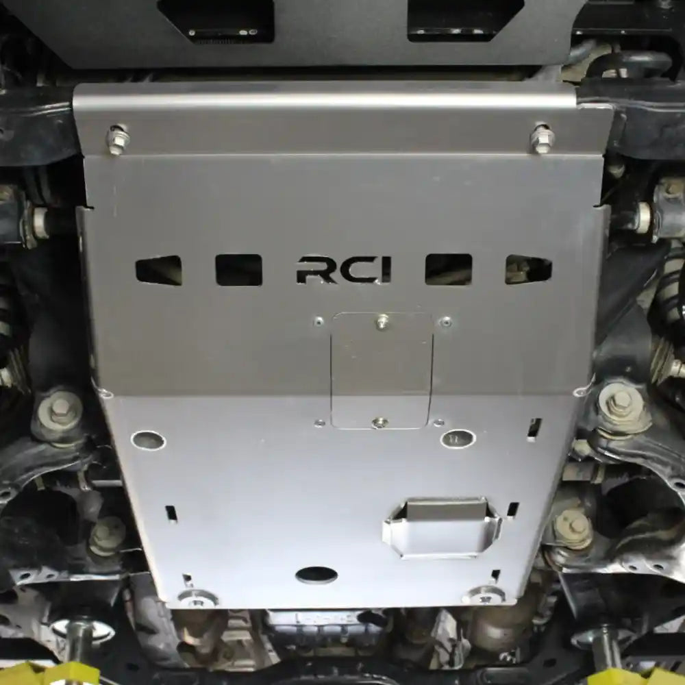 RCI skid plate hardware and mounting tabs visible on Tacoma