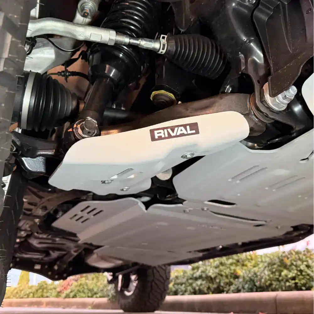 RIVAL skid plate installed on lower control arm – front view