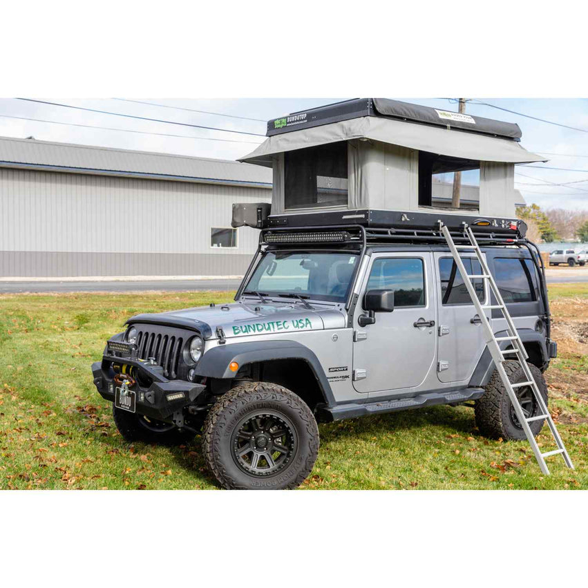 Bundutop Electric roof top tent mounted on a jeep with awning attached