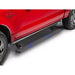 Red 2025 Ram 1500 with AMP Research PowerStep XL running boards extended, glowing with blue LED lights