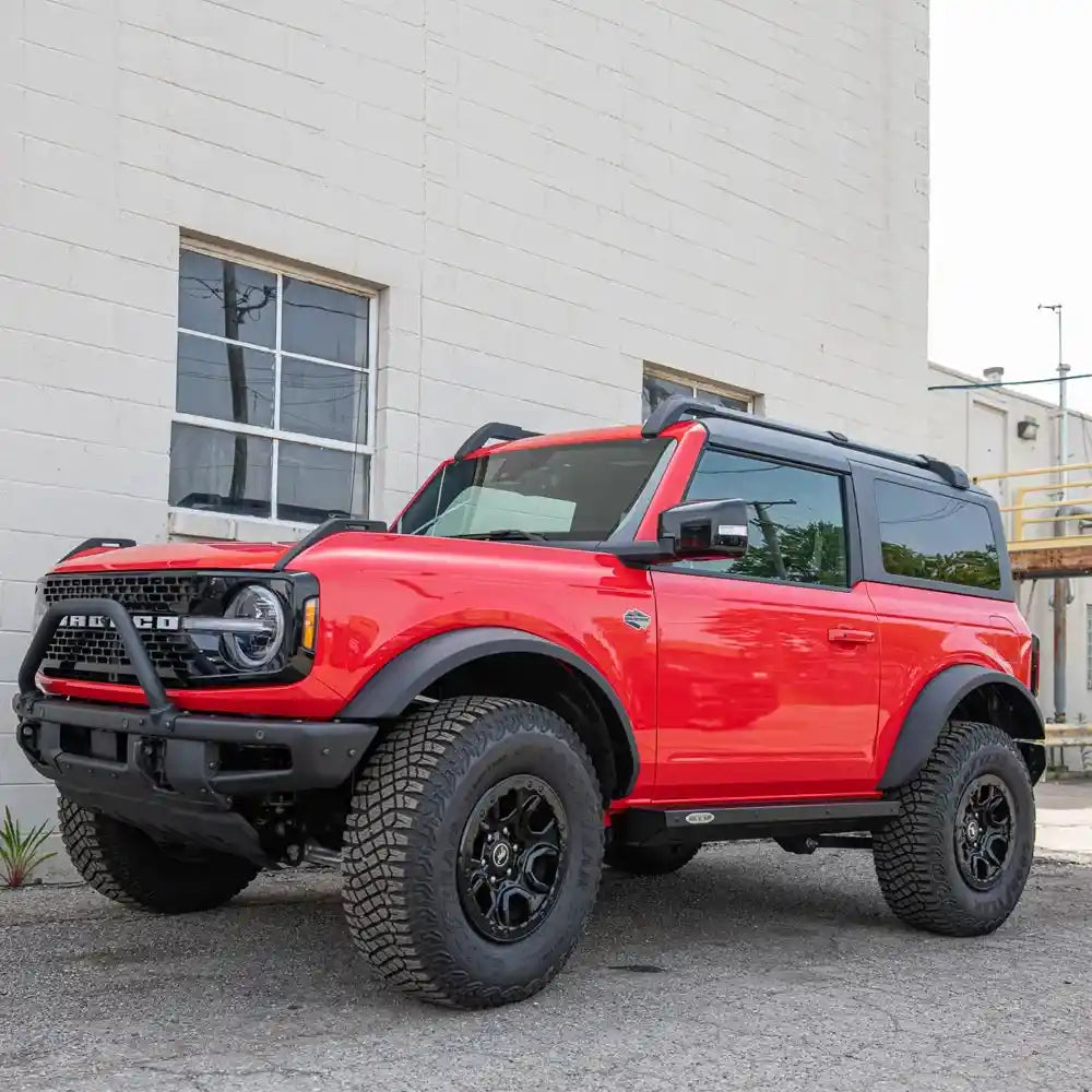 Red Bronco with Rock Slide installed