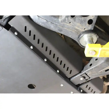 Side angle of black RCI catalytic guard on lifted vehicle