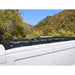 Side view of White Top Adventures roof rack mounted on Transit.