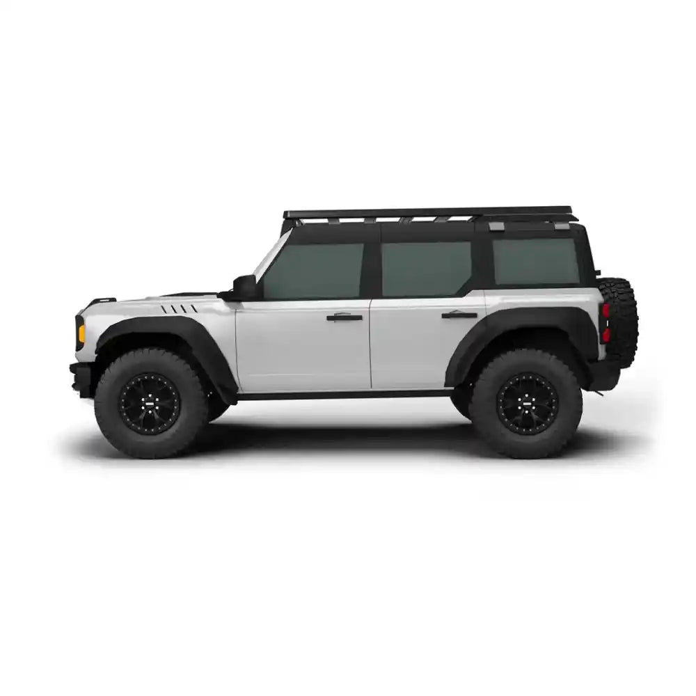 Side view of a white off-road 4Door Bronco with black roof rack on a white background
