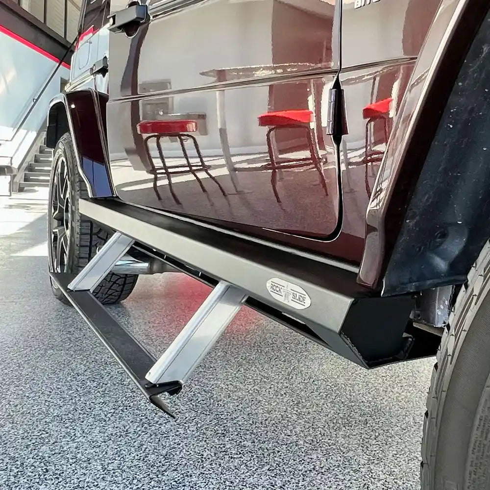 Side view of dark red Mercedes G-Wagon with Rock Slide step slider