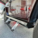 Side view of dark red Mercedes G-Wagon with Rock Slide step slider