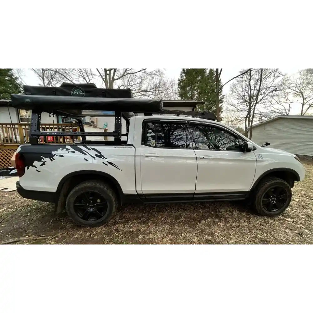 Side view of the Honda Ridgeline with mounted Shiprock and closed roof top tent on top.
