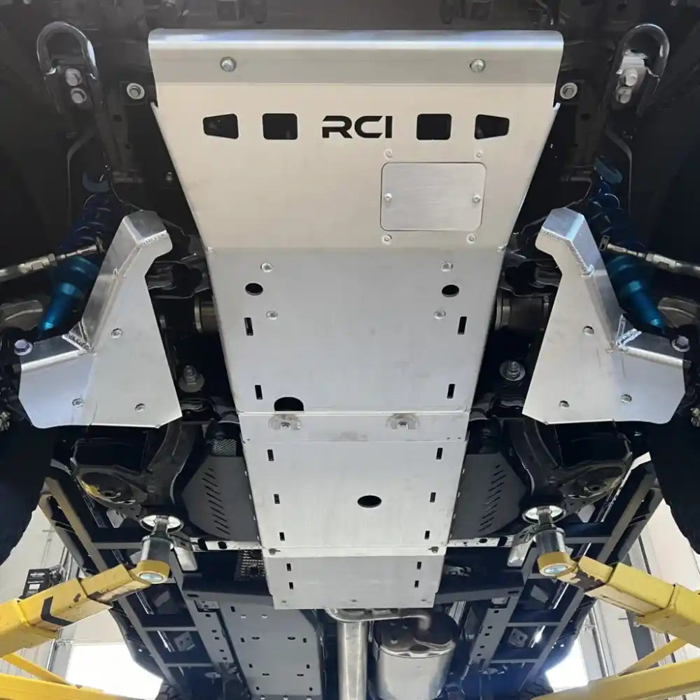 Silver RCI A-arm skid plates fully installed on 2024+ Tacoma front suspension