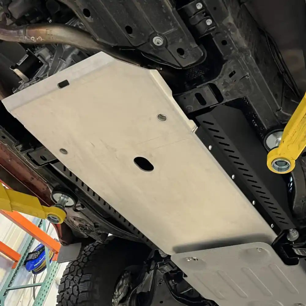 Silver RCI catalytic guard installed covering catalytic converter