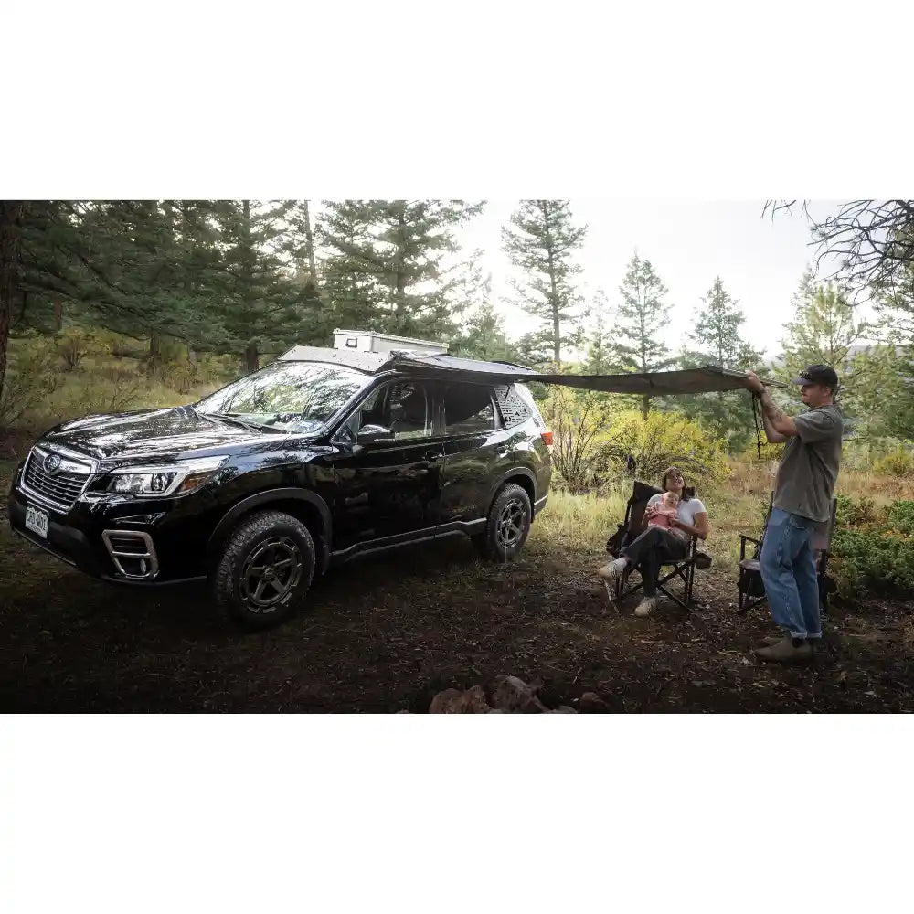 Subaru Forester camping scene with roof rack supporting gear