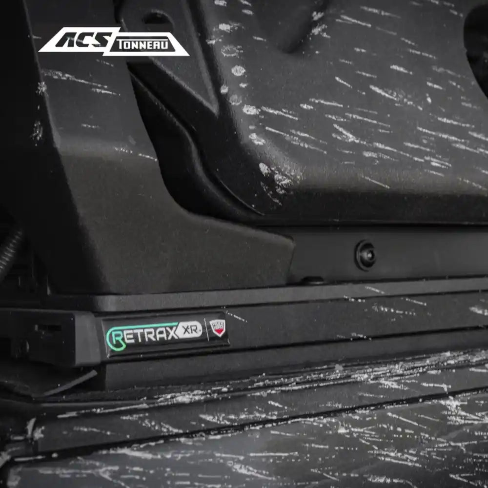 Retrax XR tonneau cover on a vehicle with ACS Tonnerro branding.