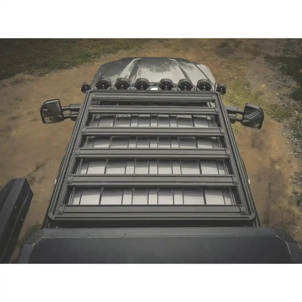 Top view of a Ford SuperDuty with a ACS roof rack on a dirt road