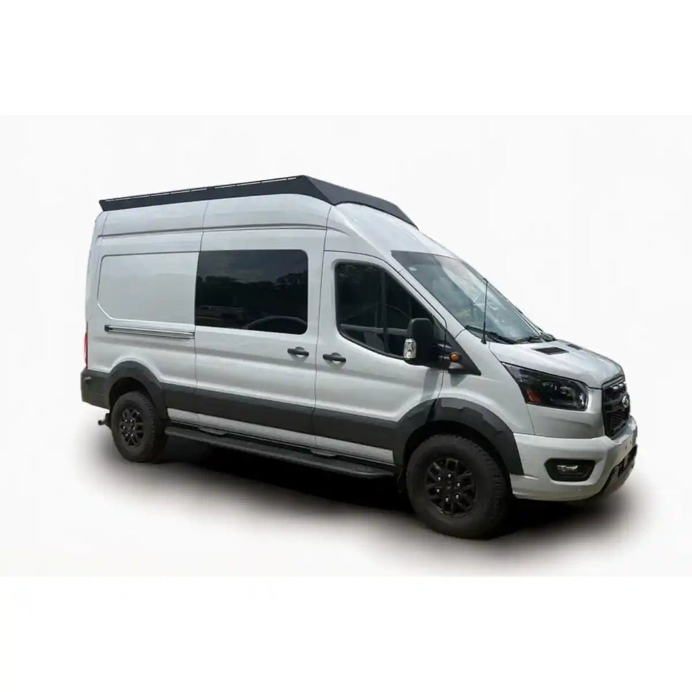 White Ford Transit with a black Orion roof rack on a white background