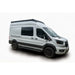 White Ford Transit with a black Orion roof rack on a white background
