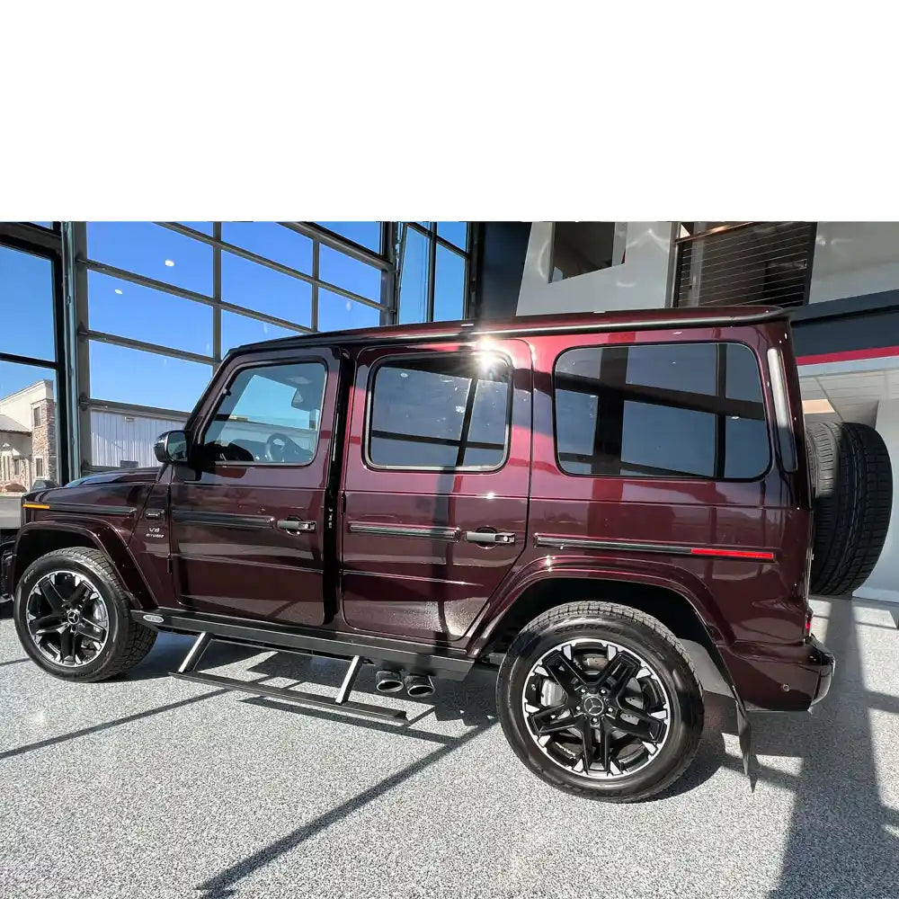Underbody angle showing Rock Slide support legs on maroon G-Wagon