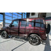 Underbody angle showing Rock Slide support legs on maroon G-Wagon